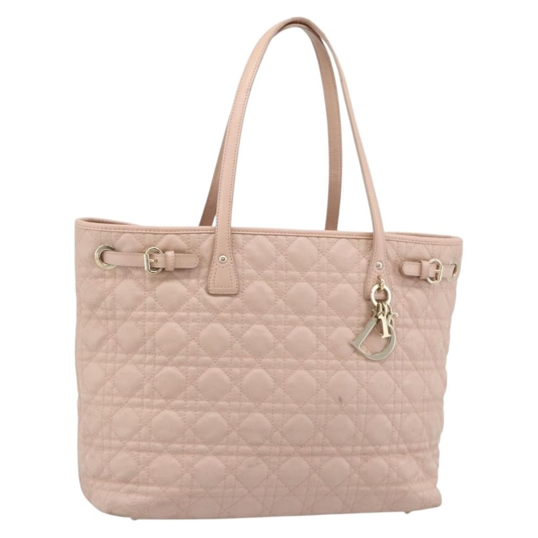 Christian Dior Panarea Cannage Tote in Pink Gold Coated Canvas: Christian Dior Panarea Cannage Tote in Pink Gold Coated Canvas A Christian Dior Canage Panarea tote bag in pink and gold, crafted from coated canvas. It comes with a dust bag and charm, and was made i