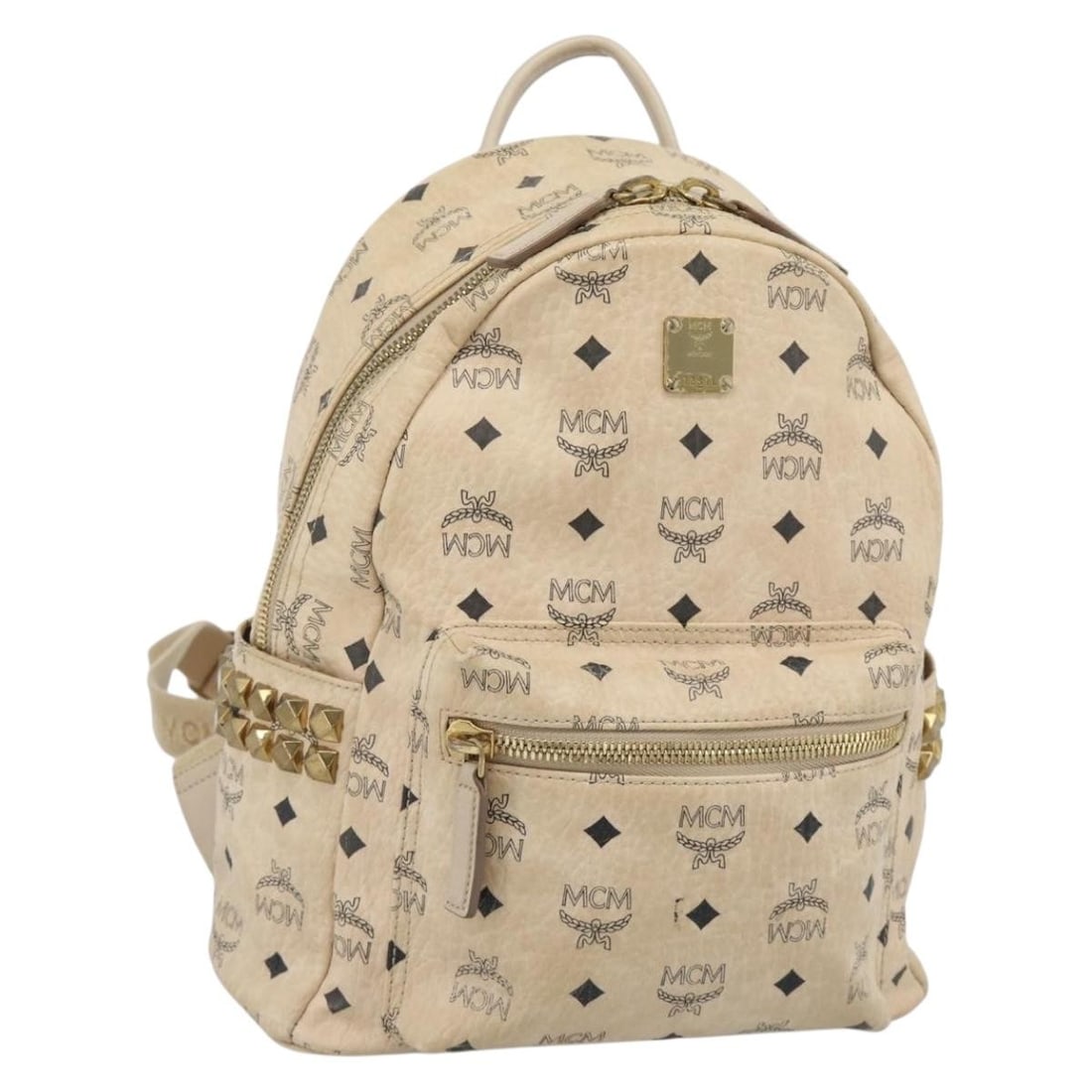 MCM Beige Gold Vicetos PVC Leather Backpack: MCM Beige Gold Vicetos PVC Leather Backpack Beige and gold MCM Vicetos logogram backpack in PVC leather, made in Korea. The bag measures approximately 26 cm W x 32 cm H x 13 cm D (10.2 x 12.6 x 5.1 in