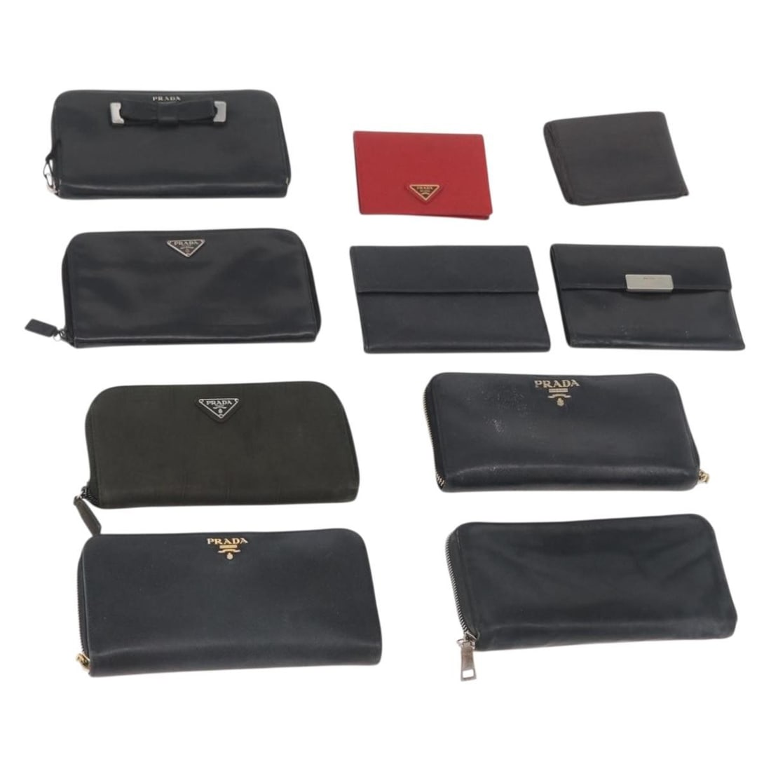 Set of 10 Prada leather wallets black red navy with guarantee card: Set of 10 Prada leather wallets black red navy with guarantee card PRADA women's leather wallet in black, red, and navy, made in Italy. This item includes a guarantee card and is offered as a special 