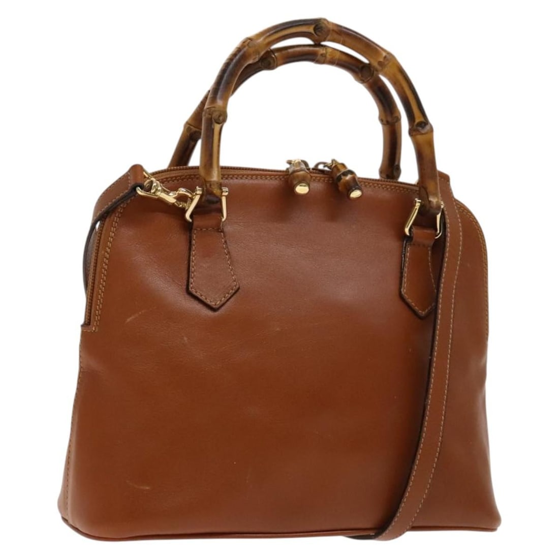 Gucci Bamboo leather handbag with shoulder strap brown gold: Gucci Bamboo leather handbag with shoulder strap brown gold This GUCCI Bamboo Hand Bag features a brown and gold leather exterior and offers versatile carrying options with both a top handle and a det