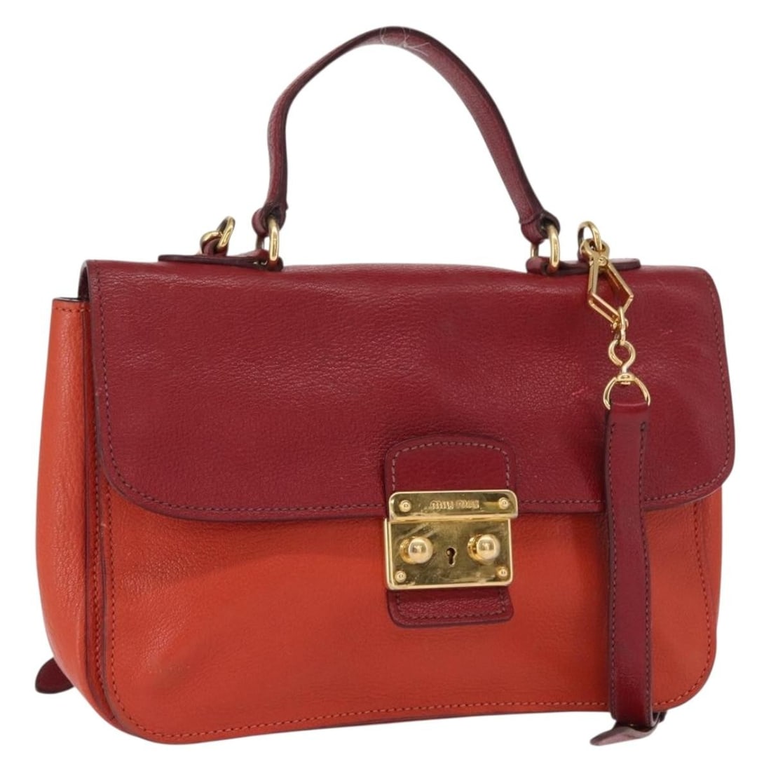 Miu Miu Red Leather 2way Handbag with Shoulder Strap: Miu Miu Red Leather 2way Handbag with Shoulder Strap Miu Miu 2-way hand bag in red and gold leather, made in Turkey. It comes with a shoulder strap and features a handle drop of 10 cm and a shoulder d