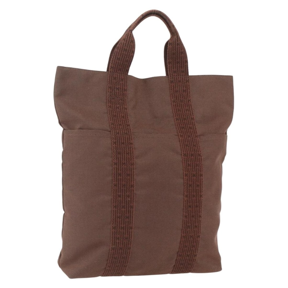 Hermes Her Line Brown Canvas Tote with Silver Accents: Hermes Her Line Brown Canvas Tote with Silver Accents This Hermes Her Line Cabas tote bag is crafted from brown and silver canvas. The bag features a spacious interior, top handles, and a practical op
