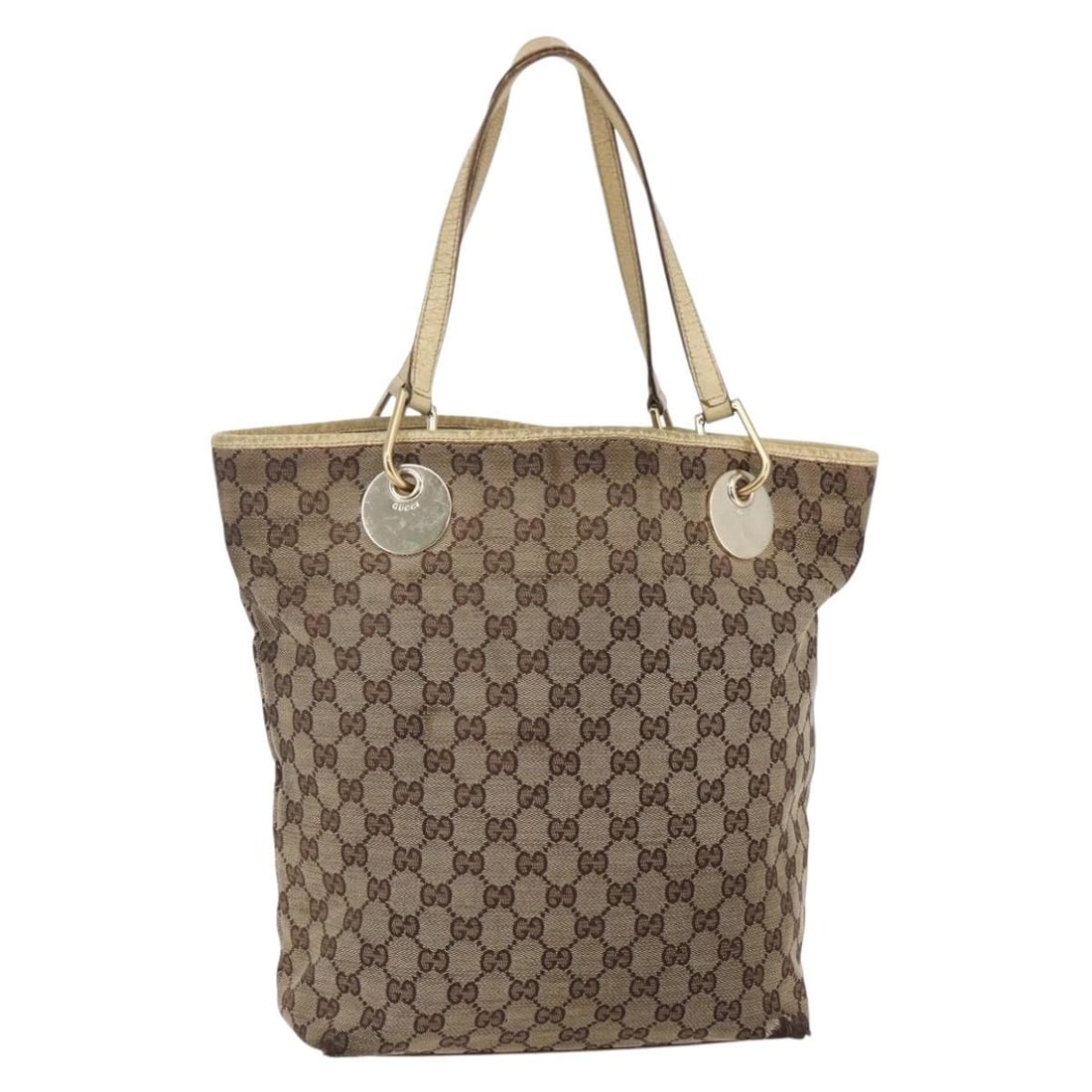 GUCCI GG Canvas Tote Bag Beige Gold 120836 Made in Italy: GUCCI GG Canvas Tote Bag Beige Gold 120836 Made in Italy This authentic GUCCI GG Canvas Tote Bag showcases a sophisticated blend of style and practicality. Crafted in Italy, this tote features a chic 