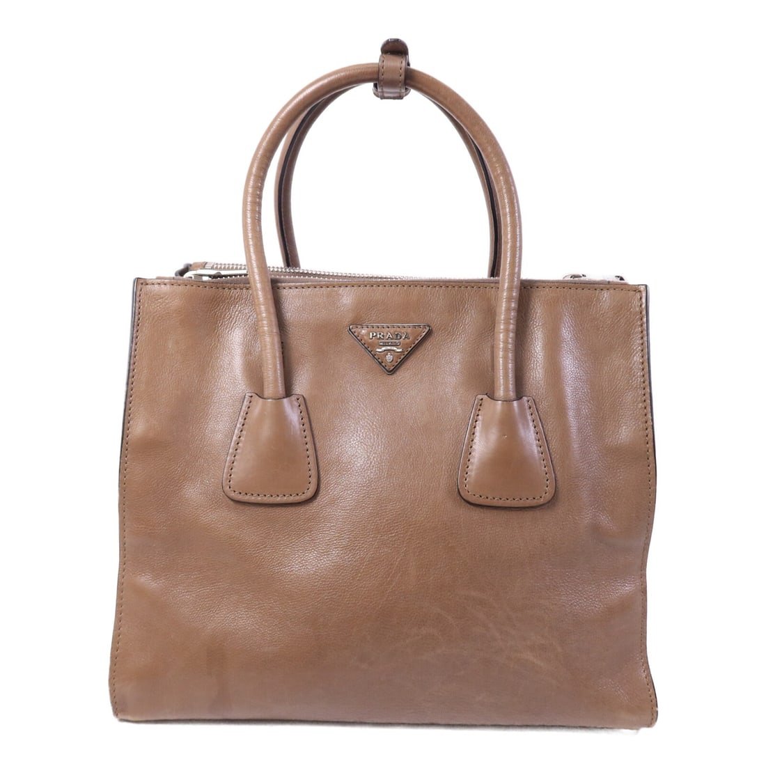 PRADA BN2619 Brown Calfskin Leather Handbag SHW: PRADA BN2619 Brown Calfskin Leather Handbag SHW A PRADA handbag crafted from calfskin (cowhide) leather in brown and taupe. It features a regular women's size, brown frame color, and was manufactured 