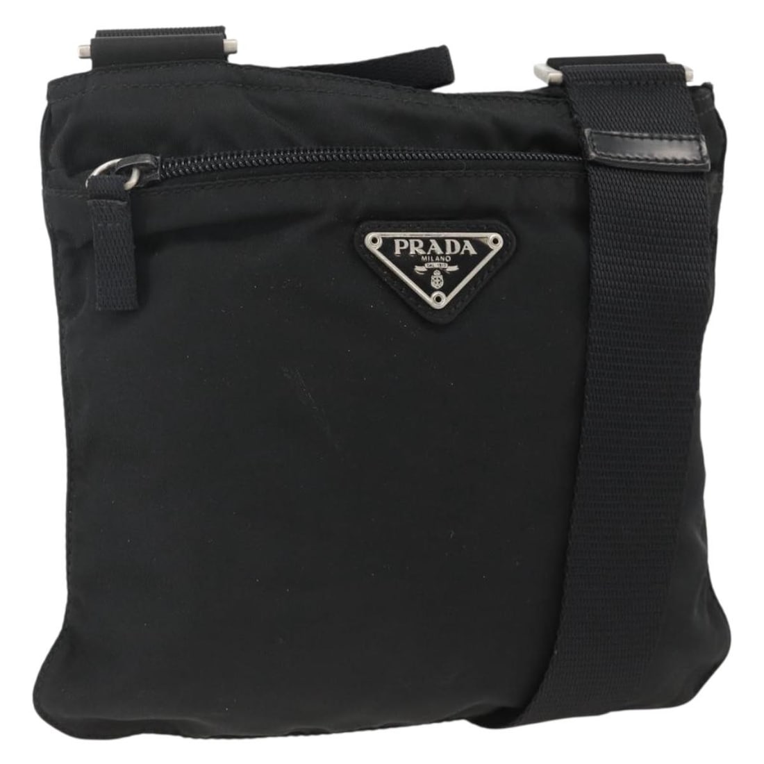 Prada Black Nylon Shoulder Purse with Silver Accents Made in Italy: Prada Black Nylon Shoulder Purse with Silver Accents Made in Italy This PRADA shoulder bag features a black nylon exterior with silver-tone accents, designed for women. Made in Italy, the bag offers a