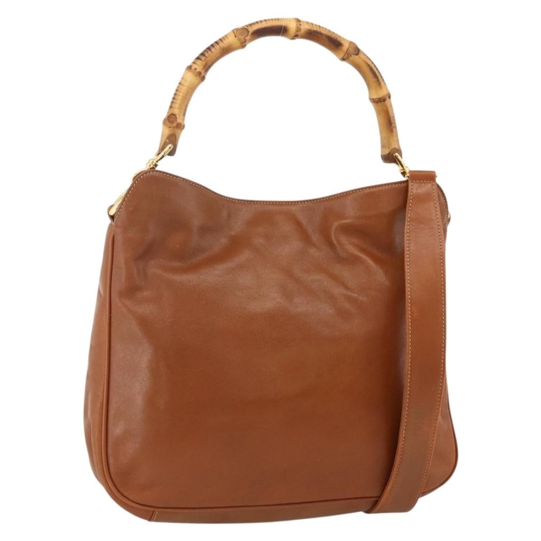 Gucci Bamboo Leather Shoulder Bag Brown Gold 2way Style with Strap: Gucci Bamboo Leather Shoulder Bag Brown Gold 2way Style with Strap This GUCCI Bamboo Shoulder Bag is crafted from brown and gold leather and designed for versatile 2-way wear. The bag features both a 