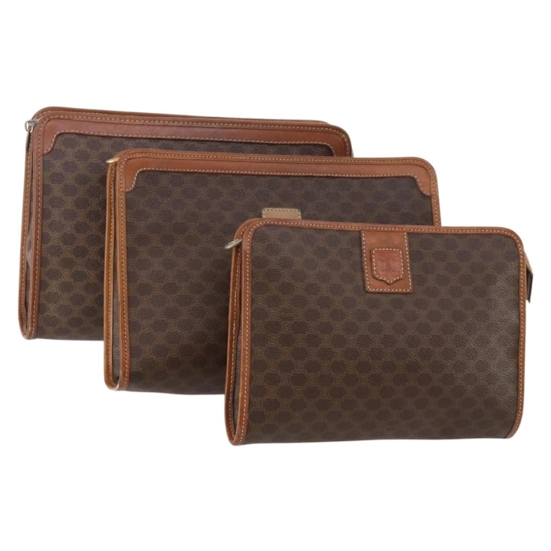 Set of 3 CELINE Macadam Brown PVC Leather Clutch Bags: Set of 3 CELINE Macadam Brown PVC Leather Clutch Bags A CELINE clutch bag made from PVC leather and Macadam canvas in brown. Made in Italy, this item is offered as a special set sale and includes only