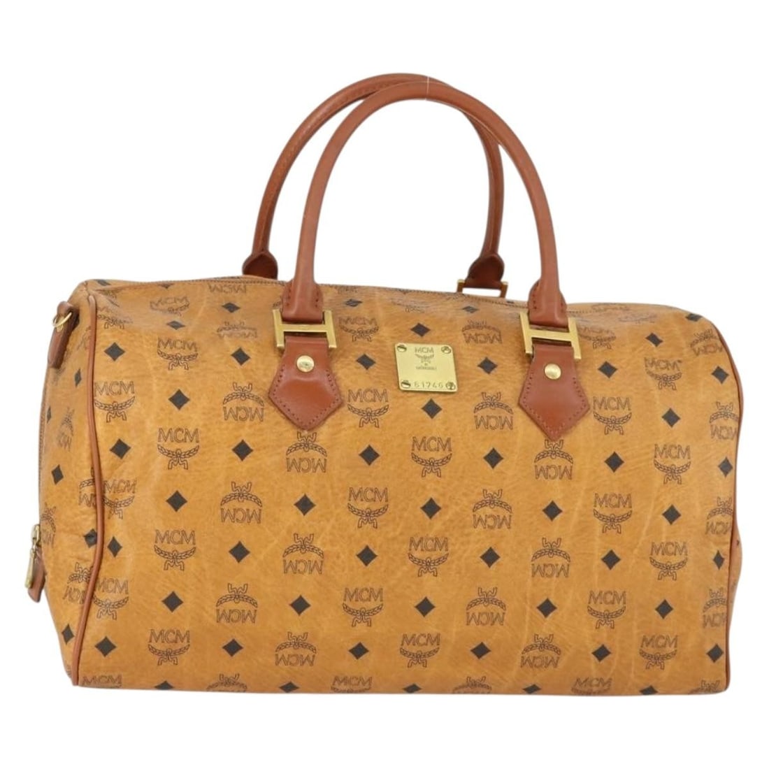 MCM Boston Bag Brown PVC Leather Gold Tone Hardware Germany: MCM Boston Bag Brown PVC Leather Gold Tone Hardware Germany This MCM Boston Bag features the iconic Visetos logogram pattern in brown and gold PVC leather. Designed for women, the bag is made in Germa