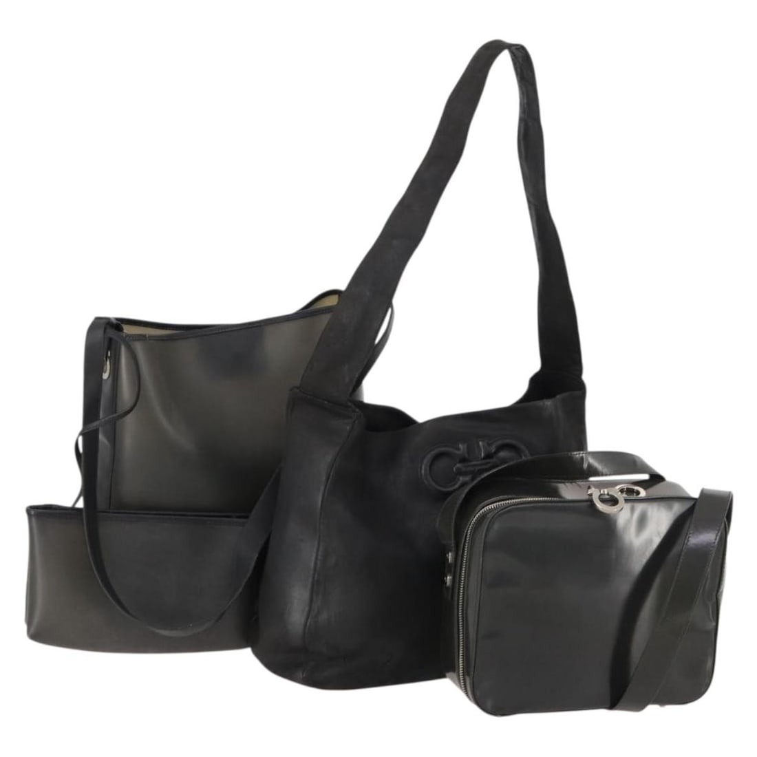 Black Leather Handbag and Pouch Set by Salvatore Ferragamo: Black Leather Handbag and Pouch Set by Salvatore Ferragamo This Salvatore Ferragamo women's handbag set includes three black leather bags, each crafted in Italy. The set features significant signs of 