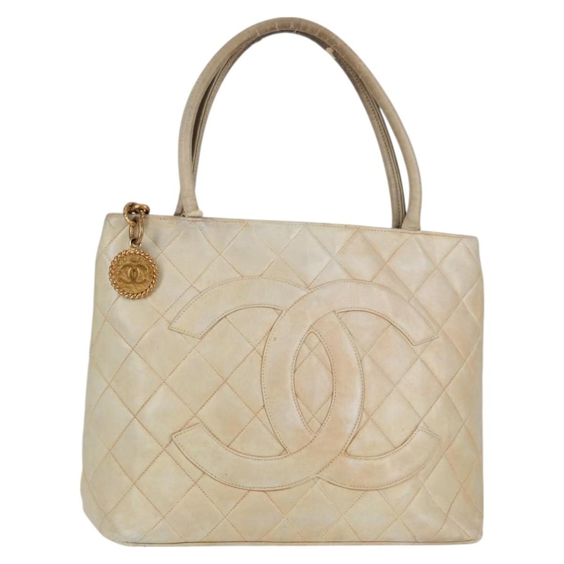 Beige Lamb Skin Tote Bag CHANEL CC Made in France: Beige Lamb Skin Tote Bag CHANEL CC Made in France Beige CHANEL tote bag crafted from lamb skin, made in France. The bag measures approximately W30 cm x H25 cm x D15 cm (W11.8 x H9.8 x D5.9 in). It is 