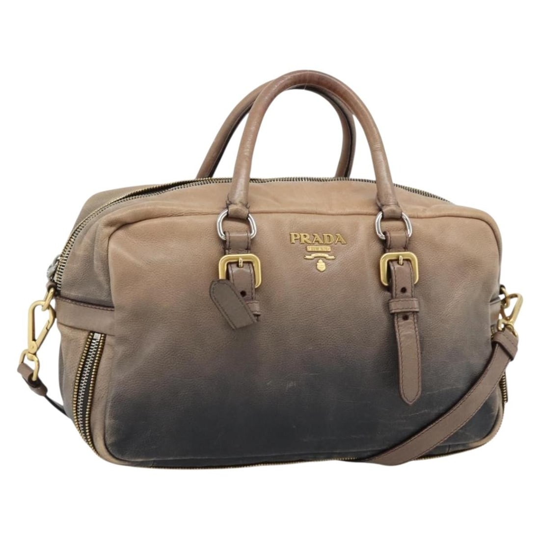 PRADA Beige Leather 2 Way Handbag with Shoulder Strap: PRADA Beige Leather 2 Way Handbag with Shoulder Strap Prada 2-way handbag in beige leather with gold-tone accents. Made in Italy, this women's bag includes a shoulder strap for hand or shoulder carry.