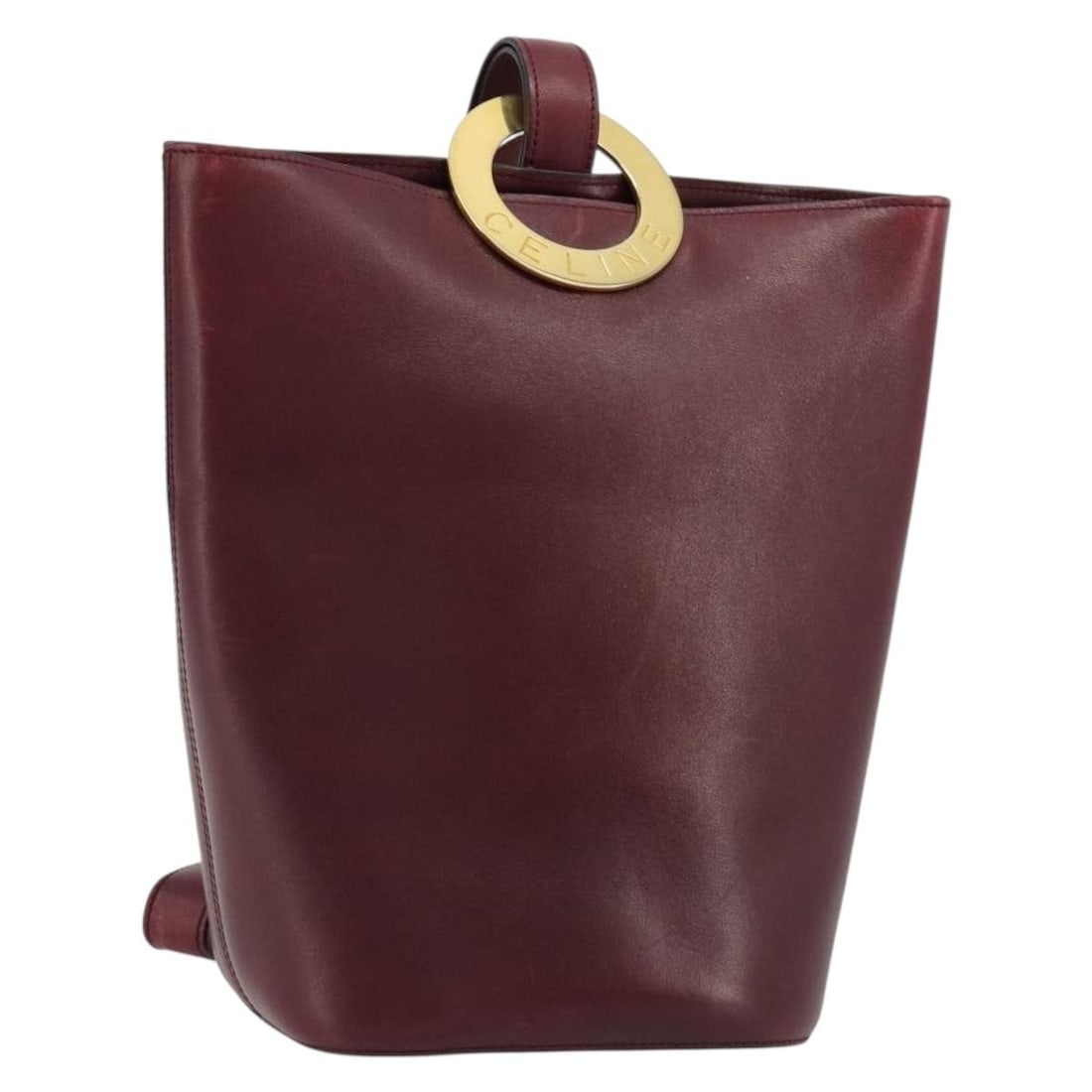 CELINE Leather Shoulder Bag Bordeaux Gold Tone Italy: CELINE Leather Shoulder Bag Bordeaux Gold Tone Italy Authentic CELINE circle shoulder bag in bordeaux leather with gold-tone accents. Made in Italy, this women's shoulder bag is offered without the or