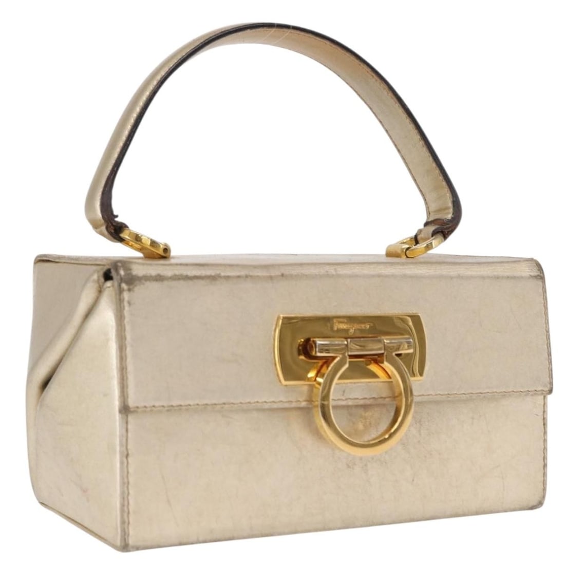 Leather Hand Bag Salvatore Ferragamo Gancini Gold Italy: Leather Hand Bag Salvatore Ferragamo Gancini Gold Italy Gold leather Gancini hand bag by Salvatore Ferragamo, made in Italy. The bag measures approximately W18 x H10 x D10 cm, with a handle drop of ap