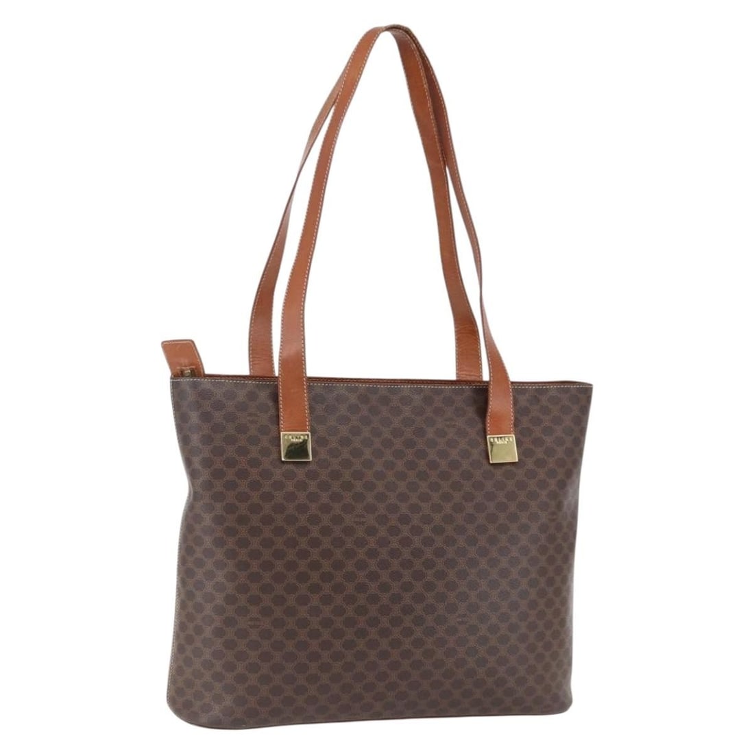 Celine Macadam Brown PVC Leather Tote Bag Gold Accents: Celine Macadam Brown PVC Leather Tote Bag Gold Accents This CELINE Macadam canvas tote bag features a brown and gold color scheme with PVC leather and canvas exterior. Designed for women, it offers a 