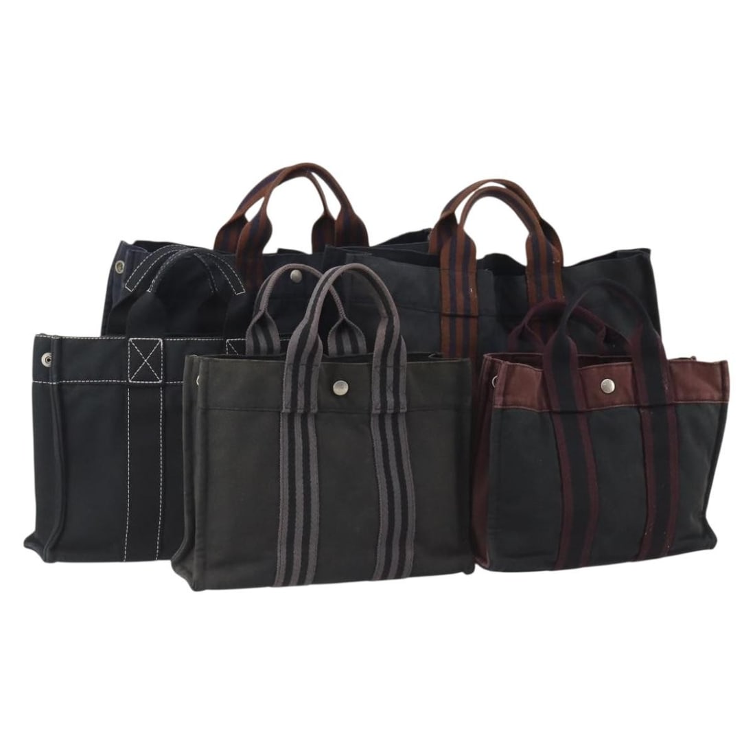 Set of 5 Hermes Fourre Tout canvas tote bags navy black khaki: Set of 5 Hermes Fourre Tout canvas tote bags navy black khaki Hermes Fourre Tout tote bag set in canvas with a navy, black, and khaki exterior. Made in France, this women's tote bag is customized and 