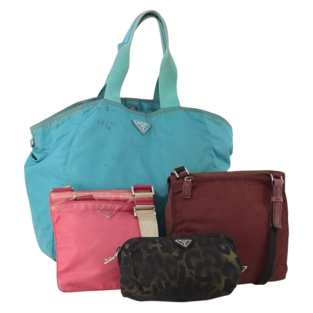 4 Prada Nylon Shoulder Bags Red Pink Light Blue Italy: 4 Prada Nylon Shoulder Bags Red Pink Light Blue Italy A Prada shoulder bag in nylon with red, pink, and light blue coloring. Made in Italy, this special set sale is offered in heavily used condition (