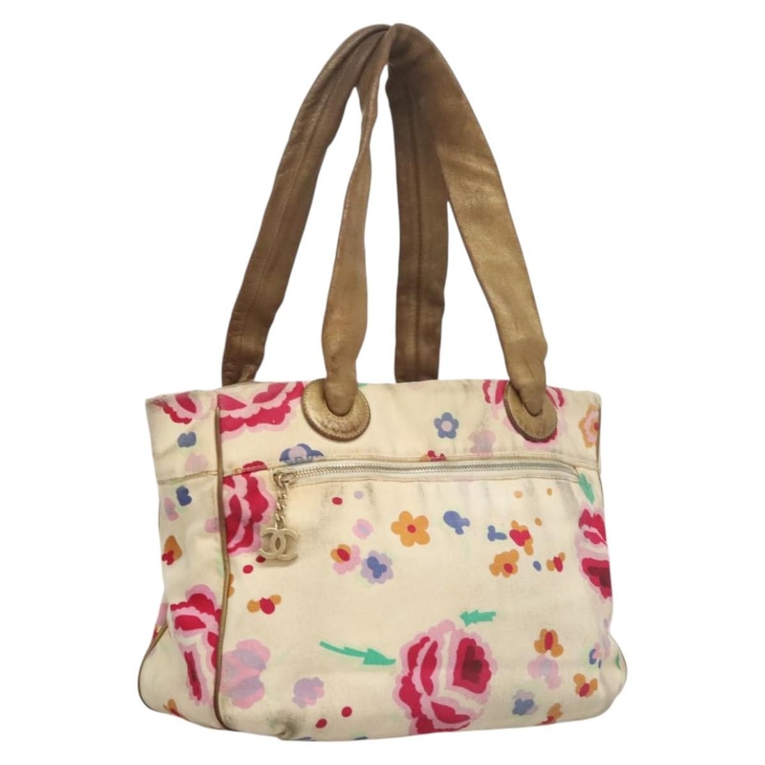 White Canvas CHANEL Tote Bag with CC Logo Italy: White Canvas CHANEL Tote Bag with CC Logo Italy This CHANEL tote bag features a white canvas exterior and is designed for women. The bag was made in Italy and showcases the classic CC logo. It include