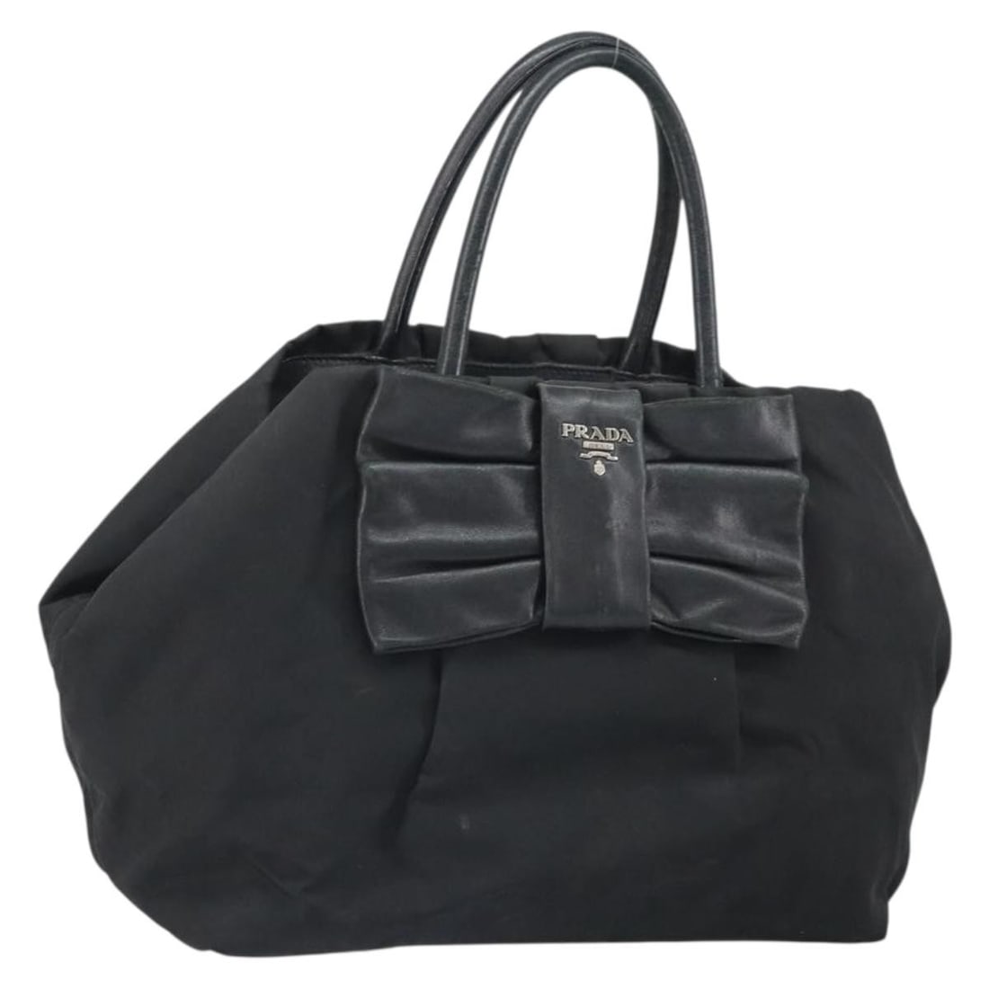 Prada black nylon women s handbag with guarantee card: Prada black nylon women s handbag with guarantee card This PRADA handbag is crafted from durable nylon in a sleek black and silver color combination. Designed for women, the bag features a spacious in
