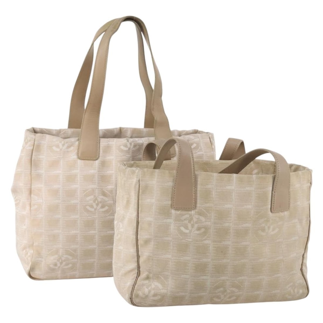 CHANEL Beige Nylon Tote Bag New Travel Line 2 Piece Set: CHANEL Beige Nylon Tote Bag New Travel Line 2 Piece Set This CHANEL Travel Line Tote Bag set includes two beige nylon tote bags designed for women. Both bags show significant signs of use, including s