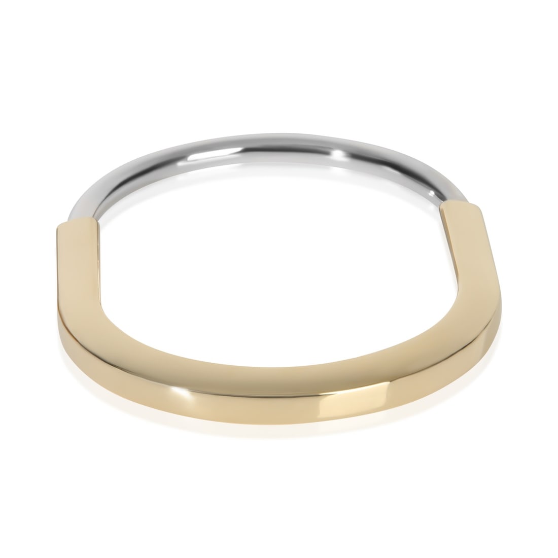 Tiffany & Co Lock Bangle 18k White Yellow Gold Bracelet 6.25 in: Tiffany & Co Lock Bangle 18k White Yellow Gold Bracelet 6.25 in This Tiffany & Co. Lock Bangle Bracelet features a sophisticated combination of 18k white gold and yellow gold, offering a timeless and 