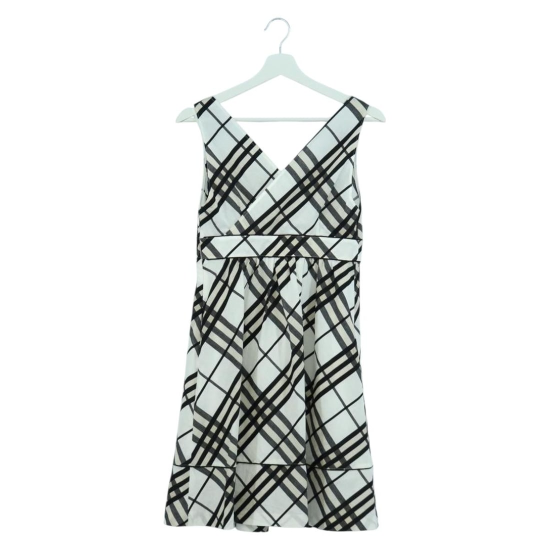 Burberry Ivory Nova Check Canvas Women's Shirt with Petticoat: Burberry Ivory Nova Check Canvas Women's Shirt with Petticoat This women's shirt by Burberry features the iconic Nova Check pattern and is crafted from canvas in an ivory color. Made in Japan, it come