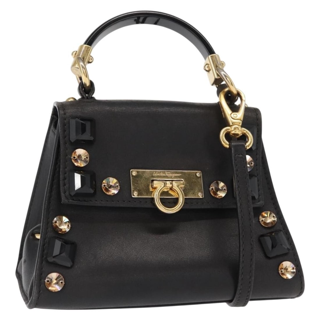 Salvatore Ferragamo Gancini Black Gold Leather 2way Hand Bag with Strap: Salvatore Ferragamo Gancini Black Gold Leather 2way Hand Bag with Strap This Salvatore Ferragamo Gancini handbag is crafted from black leather with gold-tone accents. Designed as a versatile 2-way bag