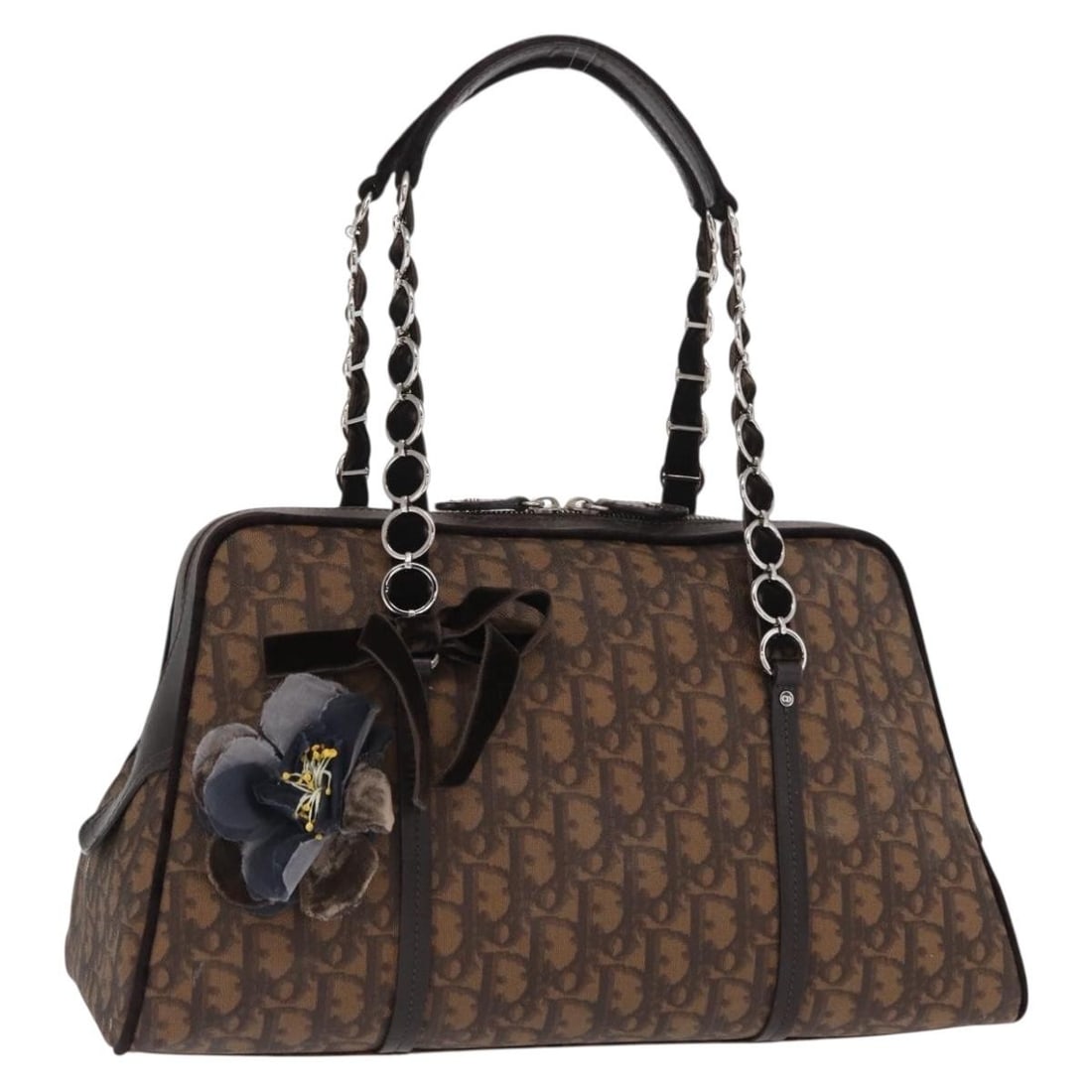 Christian Dior Romantic Trotter handbag in brown PVC canvas: Christian Dior Romantic Trotter handbag in brown PVC canvas Christian Dior Romantic Trotter canvas hand bag in brown and silver with PVC leather trim. Made in Italy, this women's handbag is offered wi