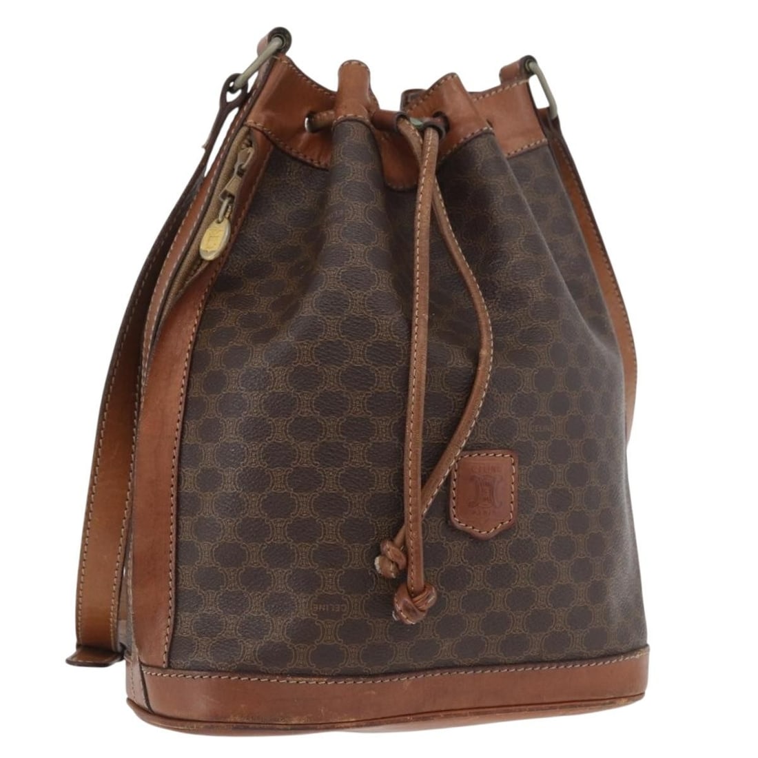 CELINE Macadam Shoulder Bag in Brown PVC Leather Gold Tone: CELINE Macadam Shoulder Bag in Brown PVC Leather Gold Tone Celine Macadam canvas shoulder bag in brown with gold-tone accents, crafted with PVC leather trim and made in Italy. This women's shoulder ba