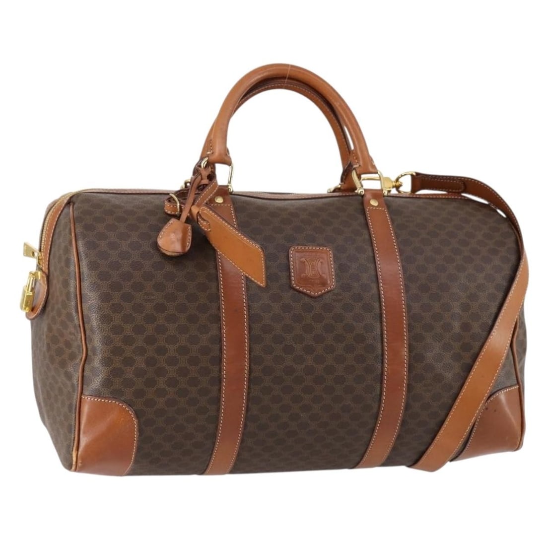 CELINE Macadam 2way Boston Bag Brown PVC Canvas Leather: CELINE Macadam 2way Boston Bag Brown PVC Canvas Leather This CELINE Boston bag is crafted from PVC leather and Macadam canvas in a brown and gold colorway. It features a 2-way design and comes with a 