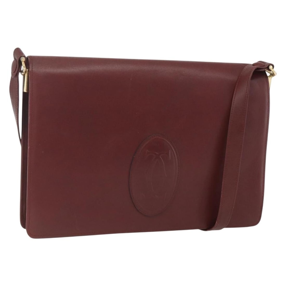 Must Line Bordeaux Leather Shoulder Bag by Cartier with Guarantee Card: Must Line Bordeaux Leather Shoulder Bag by Cartier with Guarantee Card This is a CARTIER Must Line shoulder bag crafted from bordeaux leather with gold-tone accents. The bag features a structured silh