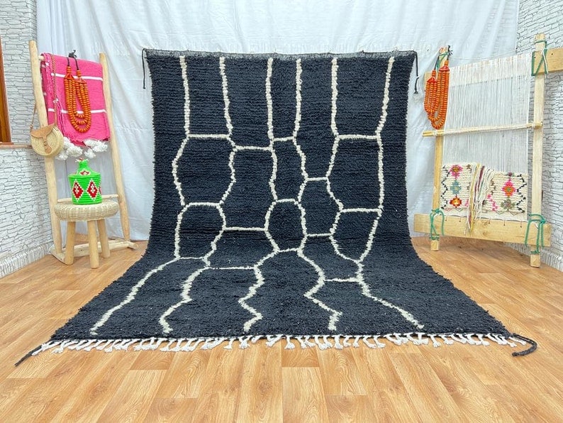Handwoven Black Rug from Morocco 100% Local Sheep Wool: Handwoven Black Rug from Morocco 100% Local Sheep Wool Experience the exquisite craftsmanship of this Stunning Elegant Black Rug, handwoven in the majestic Atlas Mountains by local Berber women weaver