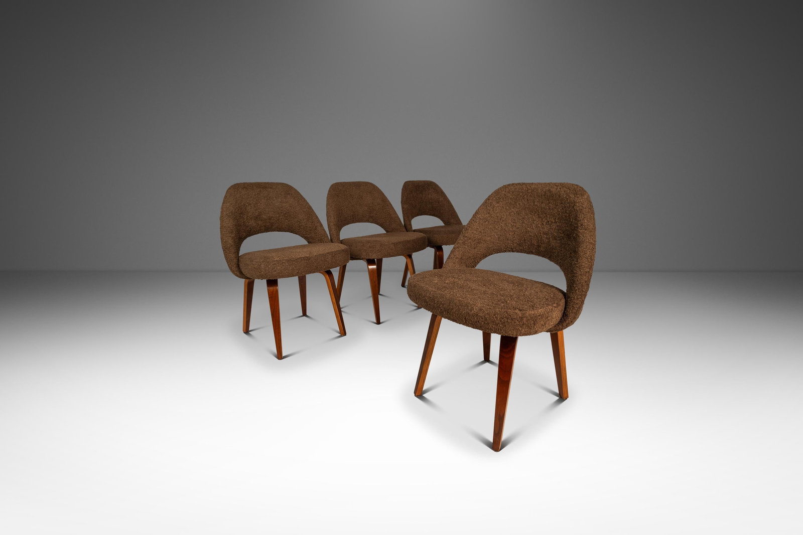 Eero Saarinen Model 72C Set of Four Armless Executive Chairs in Brown Boucle: Eero Saarinen Model 72C Set of Four Armless Executive Chairs in Brown Boucle Introducing a remarkable set of four Mid-Century Modern Model 72C armless executive chairs, expertly designed by Eero Saari
