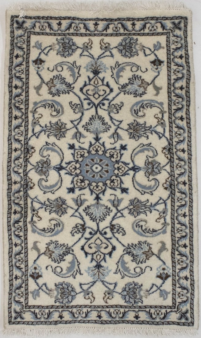 Hand-knotted wool floral area rug in cream and navy 2'4 x 4'0: Hand-knotted wool floral area rug in cream and navy 2'4 x 4'0 This handmade floral rug features a classic oriental design with a combination of cream, navy blue, blue, and khaki tones. Crafted from ha
