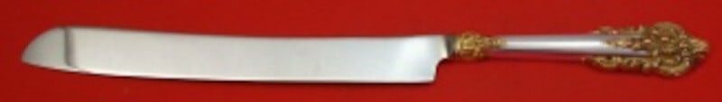 Wallace Grande Baroque Gold Accents Sterling Silver Wedding Cake Knife 12": Wallace Grande Baroque Gold Accents Sterling Silver Wedding Cake Knife 12" This exquisite wedding cake knife features the elegant Grande Baroque Gold Accents pattern by Wallace. Crafted with a sterlin