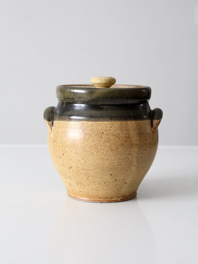 Lidded speckled tan studio pottery jar with olive brown rim (1 of 11)