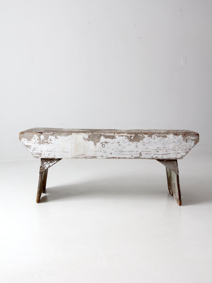 Charming Antique Farmhouse Bench Distressed White Finish: Charming Antique Farmhouse Bench Distressed White Finish Enhance your rustic decor with this charming antique farmhouse bench. Featuring a wide plank top and extended apron sides, this bench showcases