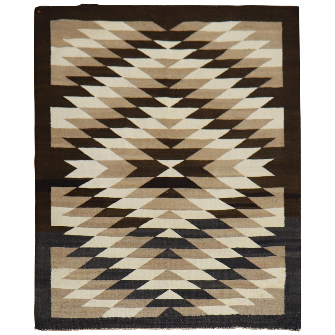Authentic 1930s American Navajo Hand-Woven Wool Rug: Authentic 1930s American Navajo Hand-Woven Wool Rug This stunning Tribal Geometric American Navajo Rug showcases a rich, all-over geometric tribal design in earthy tones of brown, charcoal, camel, and