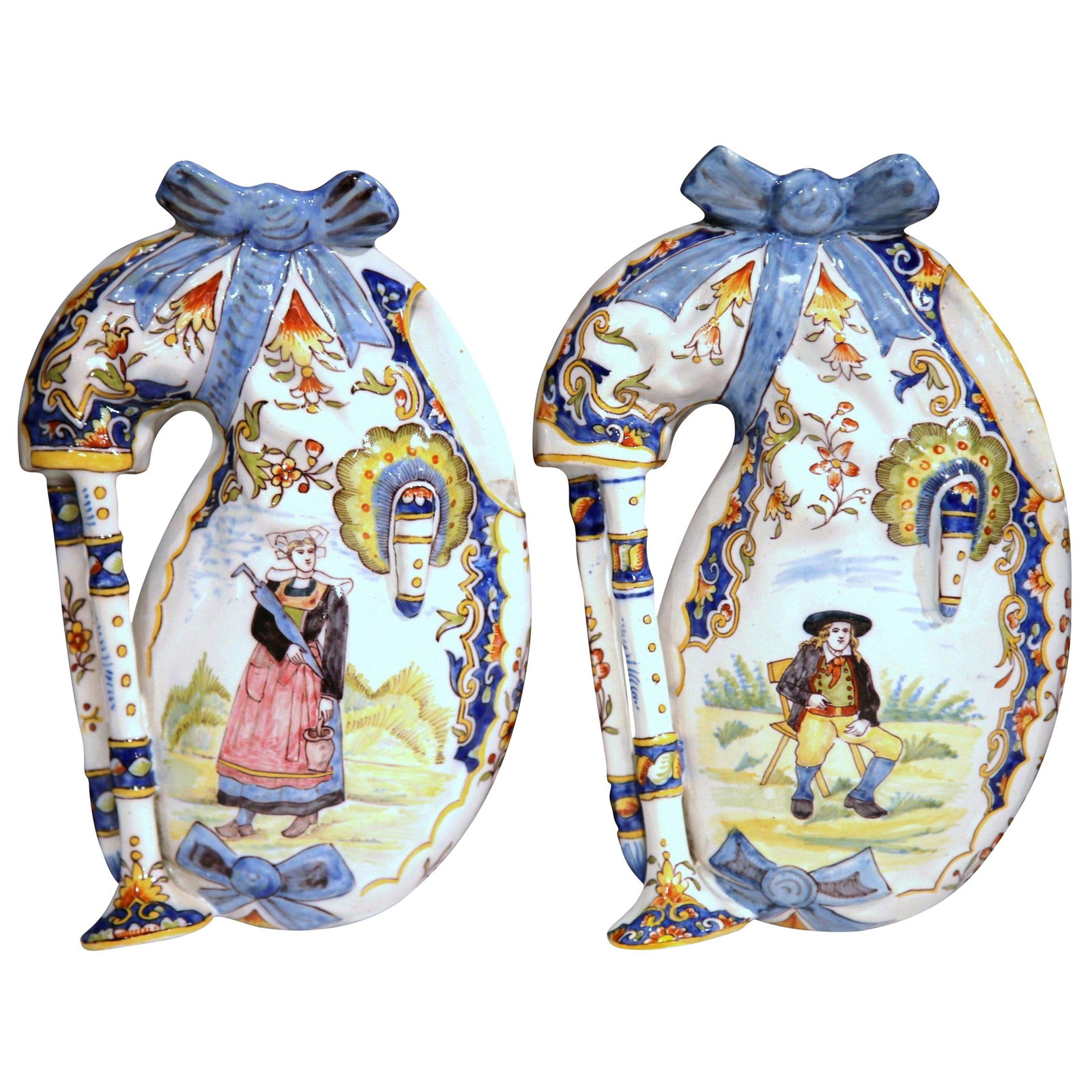 Set of 2 Breton Faience Bagpipe Wall Vases from Lorient: Set of 2 Breton Faience Bagpipe Wall Vases from Lorient This pair of late 19th-century French Breton faience wall vases from Lorient features a whimsical bagpipe form, each supported by tripod legs an