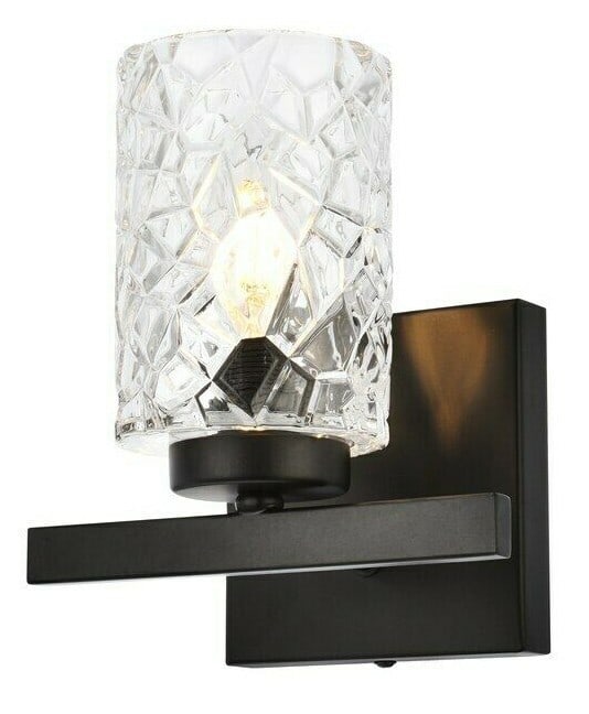 Cassie black wall sconce with clear glass shade: Cassie black wall sconce with clear glass shade Modern black wall sconce light fixture with a clear glass shade. It is hardwired, dimmable, and ETL rated, with a downward light direction. The fixture 