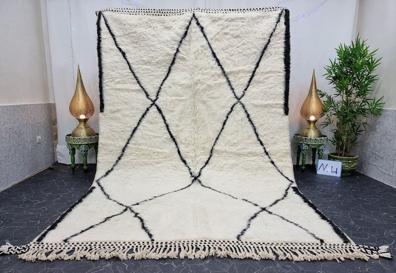Authentic Handwoven Moroccan Soft White Rug 8 x 5 Feet: Authentic Handwoven Moroccan Soft White Rug 8 x 5 Feet Experience the charm of the Atlas Mountains with this authentic Soft White Rug, handwoven by skilled Berber women weavers. Crafted using traditio