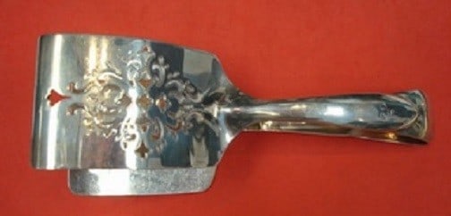 Tiffany & Co. Queen Anne Sterling Silver Asparagus Serving Tong 7.5": Tiffany & Co. Queen Anne Sterling Silver Asparagus Serving Tong 7.5" Elevate your dining experience with the exquisite Queen Anne Asparagus Serving Tong by Tiffany & Co. Measuring 7 1/2 inches, this s