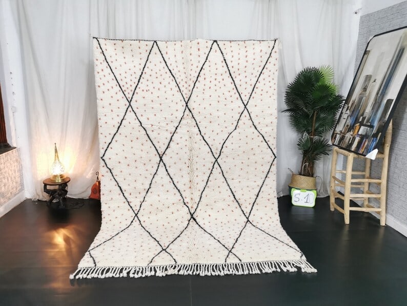 Handmade Dotted Wool Rug 8 x 5 Feet Moroccan Geometric Design: Handmade Dotted Wool Rug 8 x 5 Feet Moroccan Geometric Design Discover the beauty of this authentic handmade dotted wool rug, featuring a striking black geometric pattern. This exquisite rug is handwo