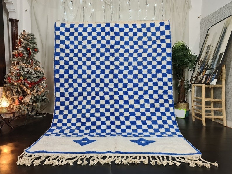 Authentic Blue White Handmade Moroccan Berber Wool Rug 9.84 x 6.56 Feet: Authentic Blue White Handmade Moroccan Berber Wool Rug 9.84 x 6.56 Feet Elevate your space with this stunning authentic blue and white handmade Moroccan Berber wool area rug. Featuring a unique chess 