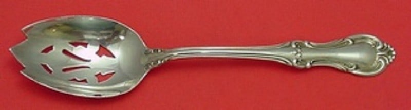 International Sterling Silver Joan of Arc Slotted Serving Spoon 8 3/8": International Sterling Silver Joan of Arc Slotted Serving Spoon 8 3/8" This exquisite serving spoon features the elegant "Joan of Arc" pattern by International Silver, expertly crafted from high-quali