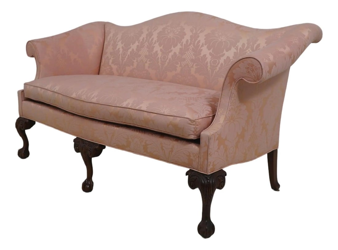 Mahogany Camelback Sofa With Peach Damask Upholstery And Claw Feet: Mahogany Camelback Sofa With Peach Damask Upholstery And Claw Feet This Southwood sofa features a classic camelback design and is upholstered in peach damask fabric. It is constructed with high-qualit