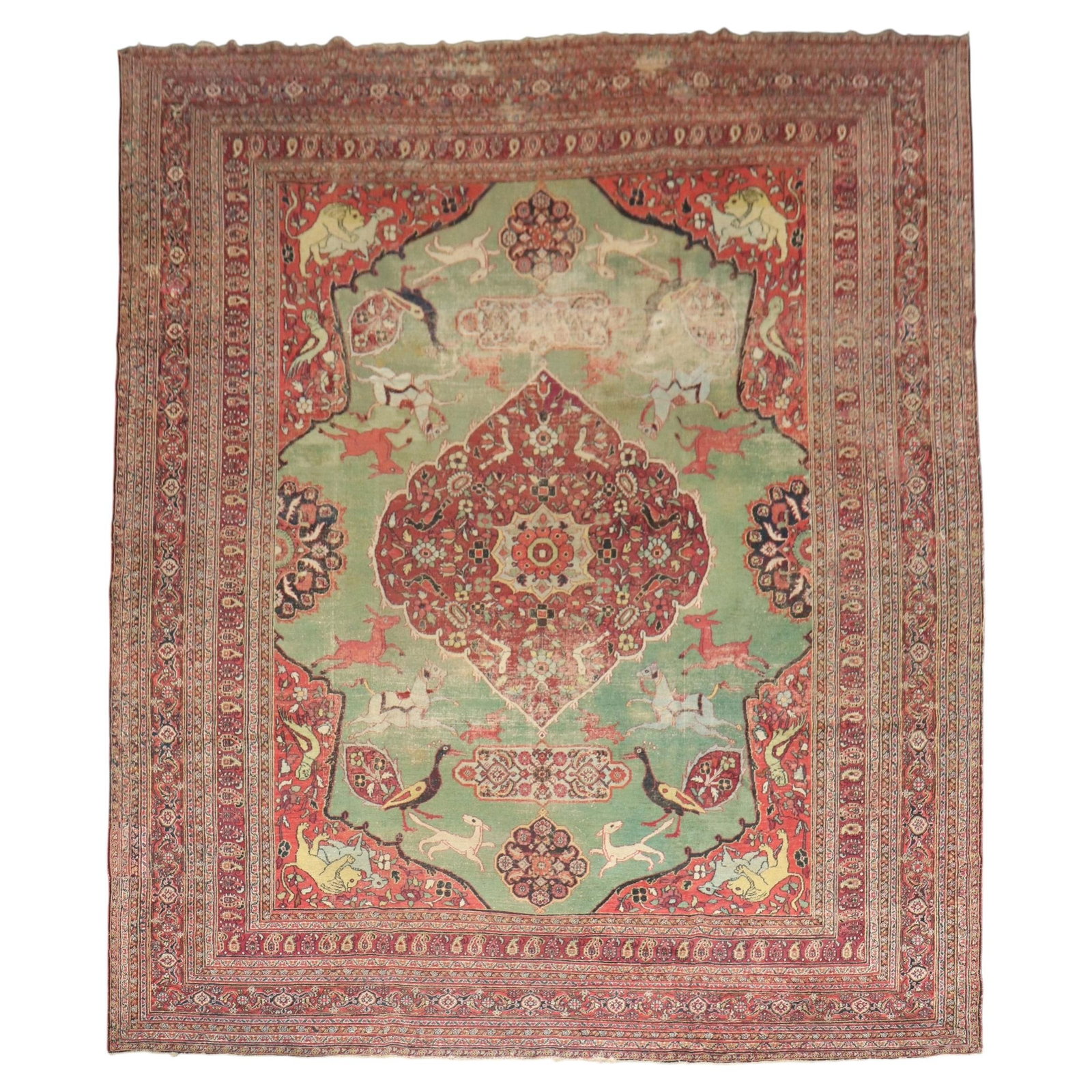 19th Century Hand Knotted Wool Doroksh Hunting Rug 10'2 x 12'10: 19th Century Hand Knotted Wool Doroksh Hunting Rug 10'2 x 12'10 This 19th-century Persian Doroksh carpet features a distressed green field adorned with a hunting animal motif. Hand-knotted from wool, 