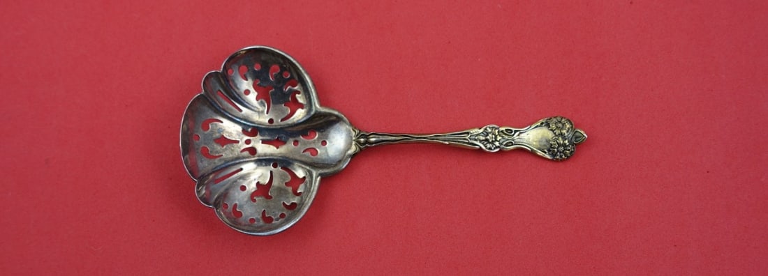 Alvin Majestic Sterling Silver Pierced Nut Spoon 4.75": Alvin Majestic Sterling Silver Pierced Nut Spoon 4.75" Enhance your serving collection with this exquisite Majestic by Alvin Sterling Silver Nut Spoon. Crafted from high-quality sterling silver, this 