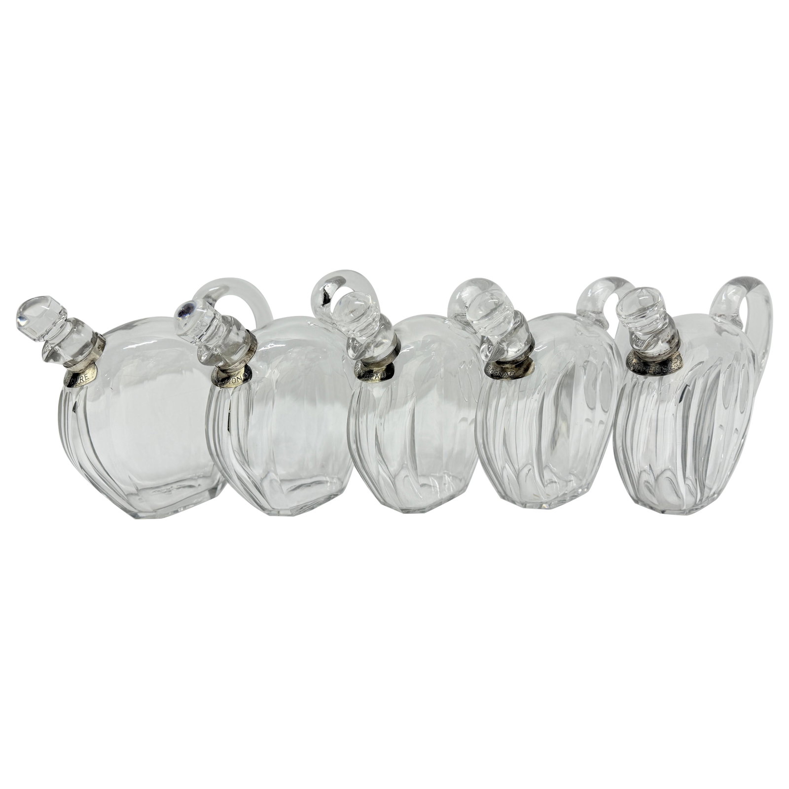 Set of 5 Art Deco Crystal Liqueur Decanters by Jacques Adnet for Baccarat: Set of 5 Art Deco Crystal Liqueur Decanters by Jacques Adnet for Baccarat Presenting a remarkable set of five crystal liqueur decanters designed by Jacques Adnet for Baccarat, dating back to circa 193