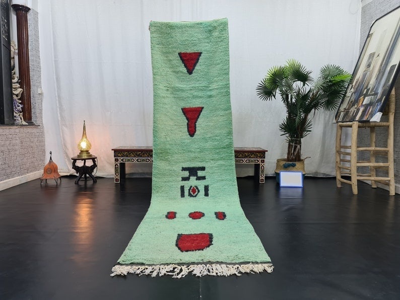 Handmade Moroccan Green Wool Runner Rug 2 x 10 Feet: Handmade Moroccan Green Wool Runner Rug 2 x 10 Feet Experience the elegance of this stunning green runner rug, handwoven with care by local Berber women in the Middle Atlas mountains of Morocco. Craft