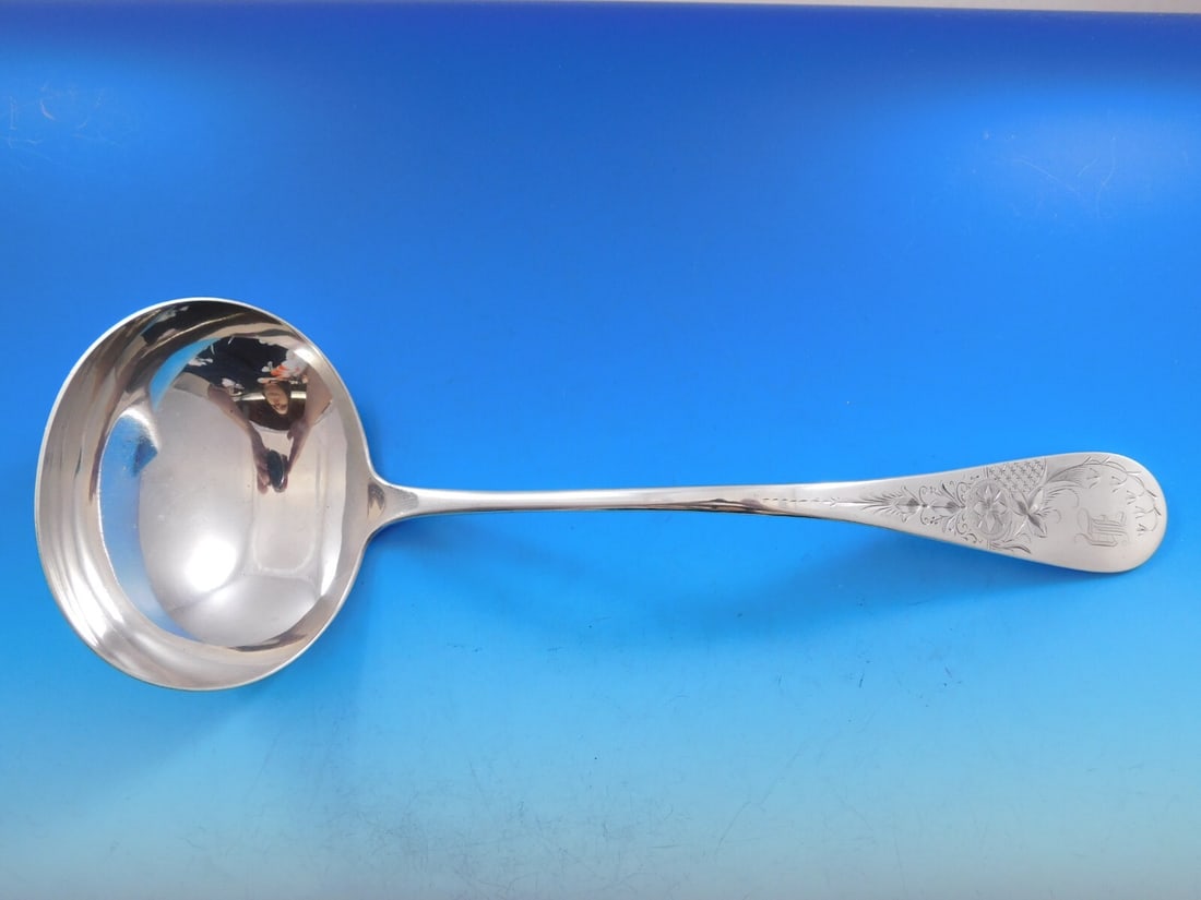 Whiting Sterling Silver Antique Lily Engraved Soup Ladle 12 1/2": Whiting Sterling Silver Antique Lily Engraved Soup Ladle 12 1/2" This exquisite soup ladle features the Antique Lily Engraved pattern, crafted by Whiting in sterling silver. Measuring 12 1/2 inches, t